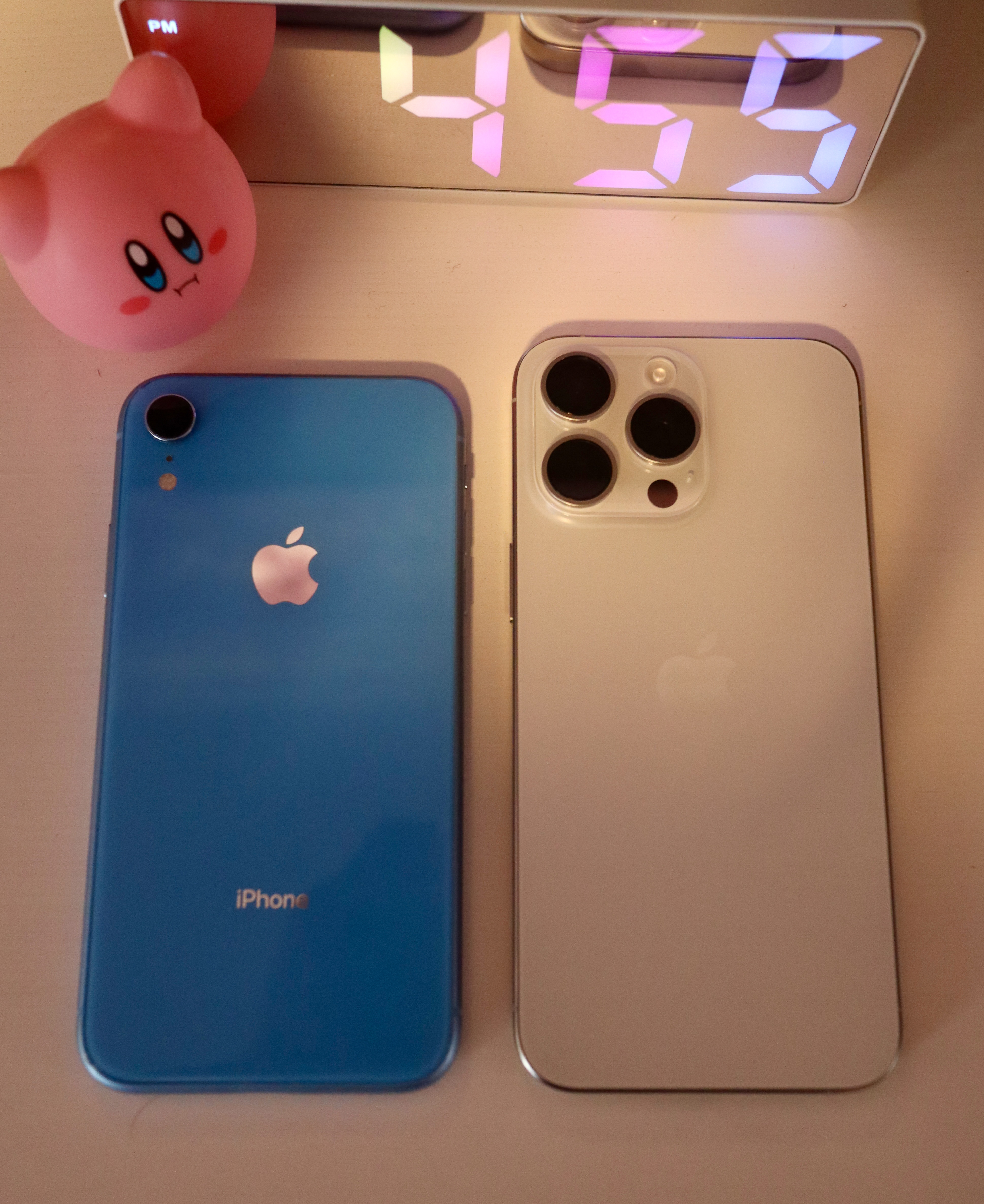 my old iPhone XR, left, next to my newer iPhone 15 Pro Max, right